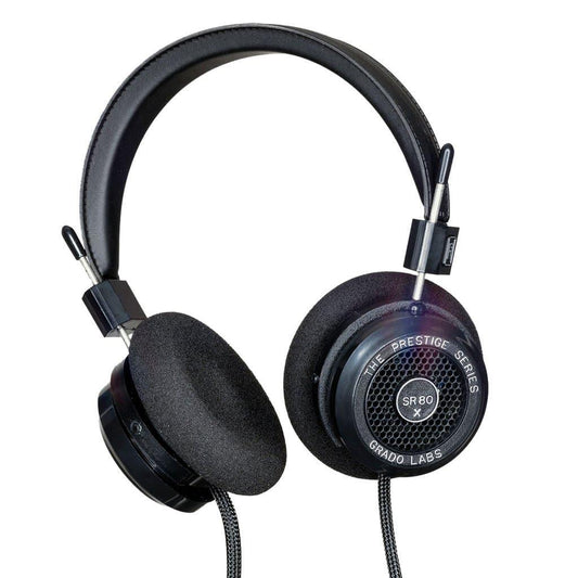 The Grado SR80x Headphones by Grado feature black over-ear design with foam ear pads, a padded headband, X Series Driver for enhanced soundstage, and The Prestige Series Grado SR80x labeled on the ear cups, shown against a white background.