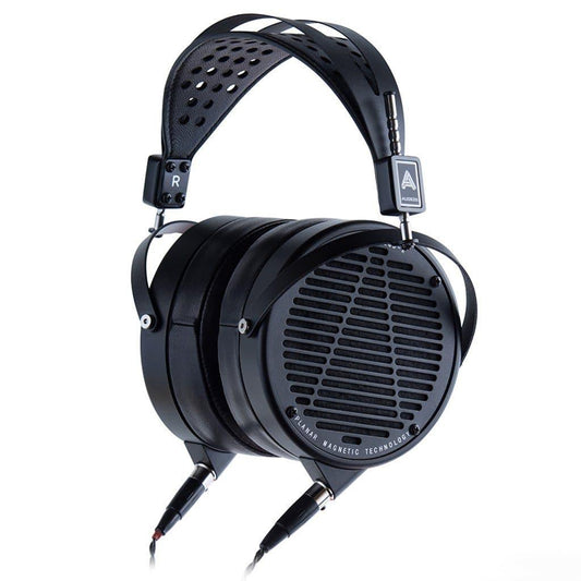 The Audeze LCD-X 2024 Creators Edition Open Box are black planar magnetic over-ear headphones with an open grille, wide perforated headband, and dual cable connections—ideal for professional mixing and high-performance audio.