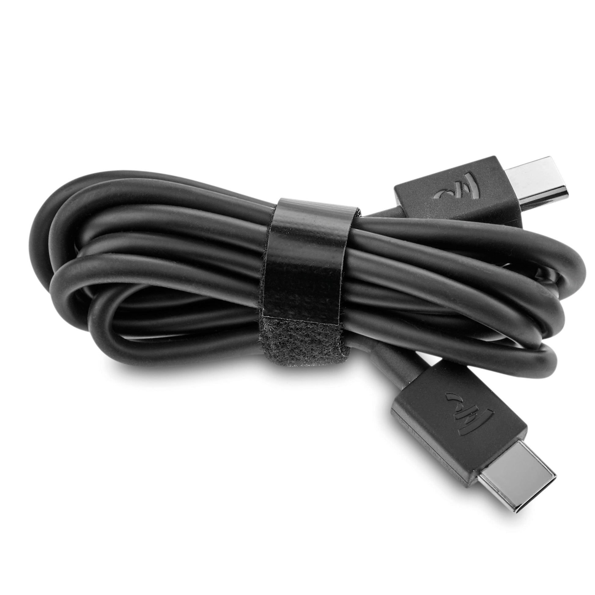 A black USB-C to USB-C cable, neatly coiled with a Velcro strap and both connectors visible, is ideal for charging or updating your Focal Bathys headphones from Focal.