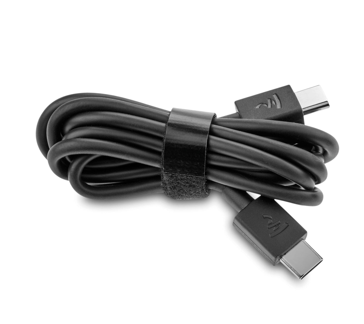 A black USB-C to USB-C cable, neatly coiled with a Velcro strap and both connectors visible, is ideal for charging or updating your Focal Bathys headphones from Focal.