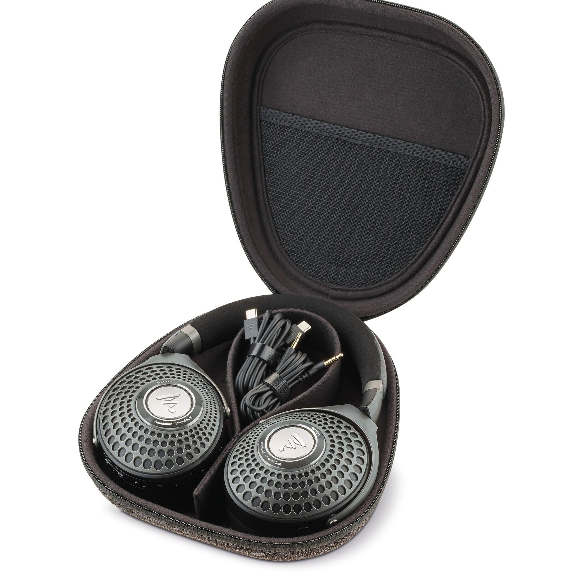 A pair of large, over-ear Focal Bathys active noise-canceling headphones in a black Focal carrying case, with coiled cables beside them; the case has a mesh pocket in the lid—ideal for your Bathys or accessories.