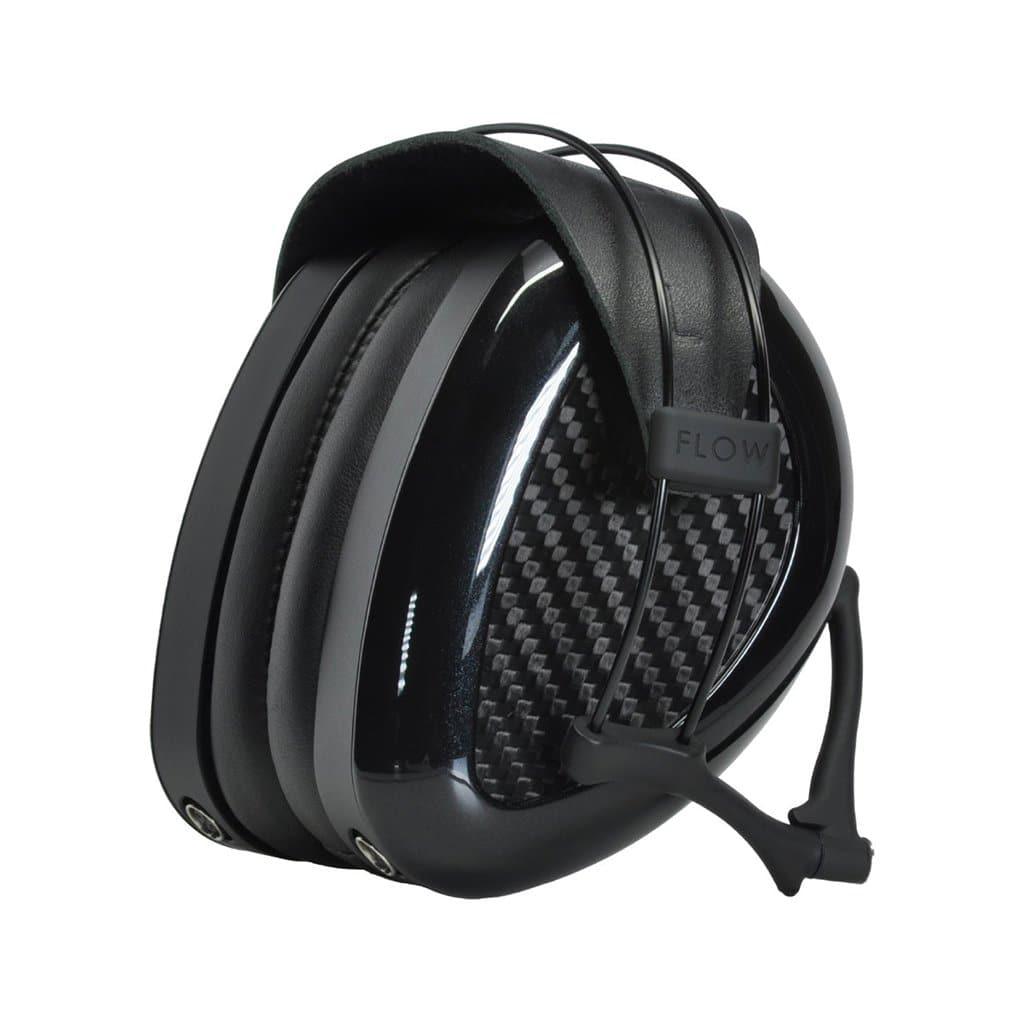 A pair of Dan Clark Audio AEON 2 Noire Headphones with black carbon fiber-patterned ear cups and a padded headband, positioned upright with the ear cups touching. The word FLOW appears on the side.