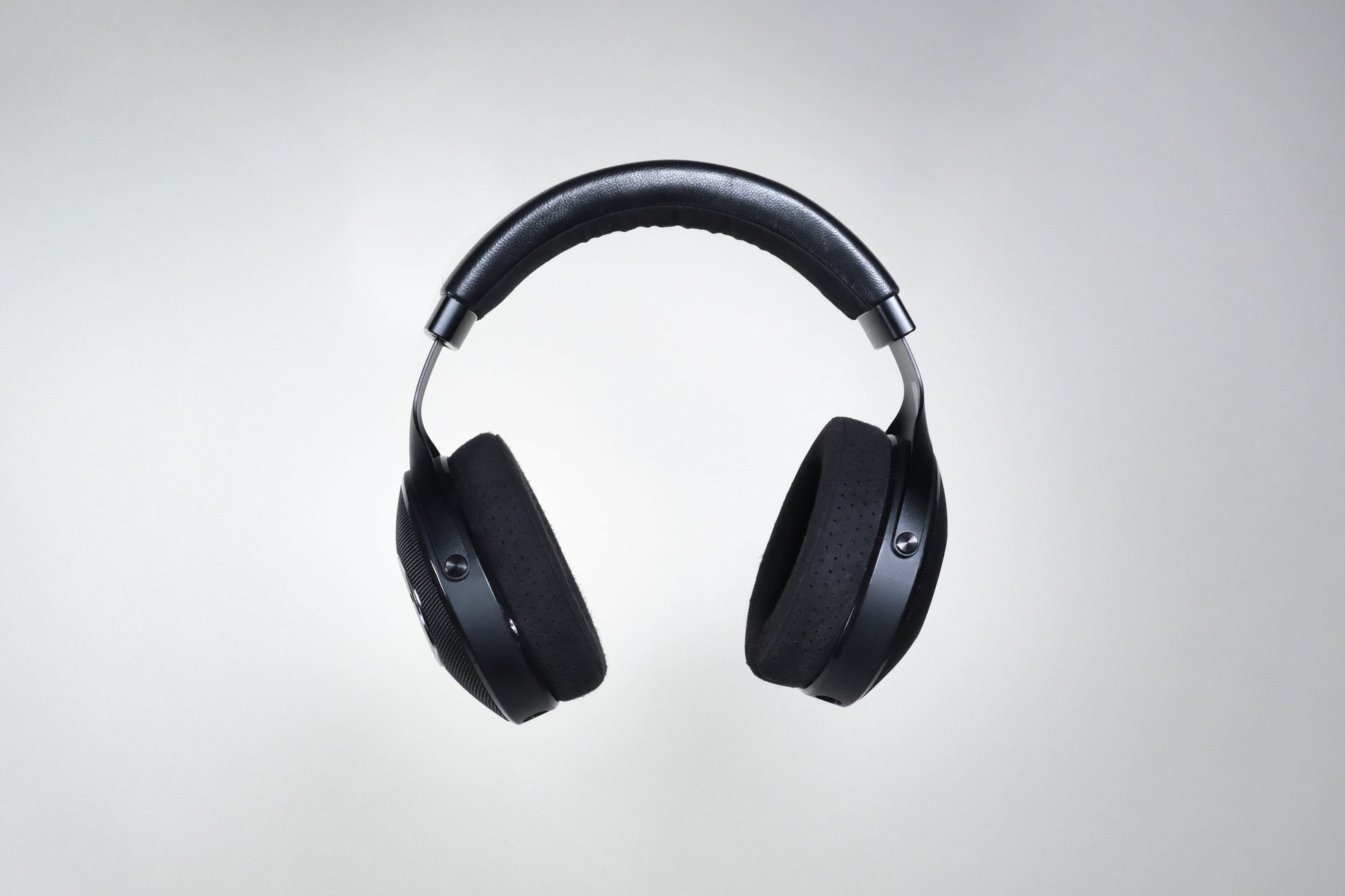 The Focal Elex Headphones by Focal feature cushioned ear pads and headband in black, shown against a plain light gray background, offering sonic perfection for an immersive listening experience.