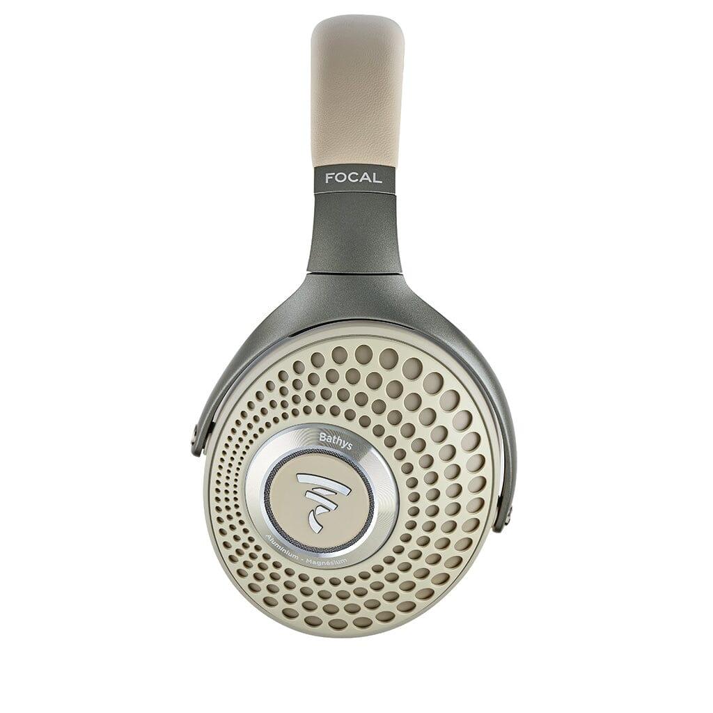 The Focal Bathys by Focal is a beige and gray over-ear headphone featuring a circular perforated earcup with the Focal logo, combining active noise-canceling, premium sound, and modern style.