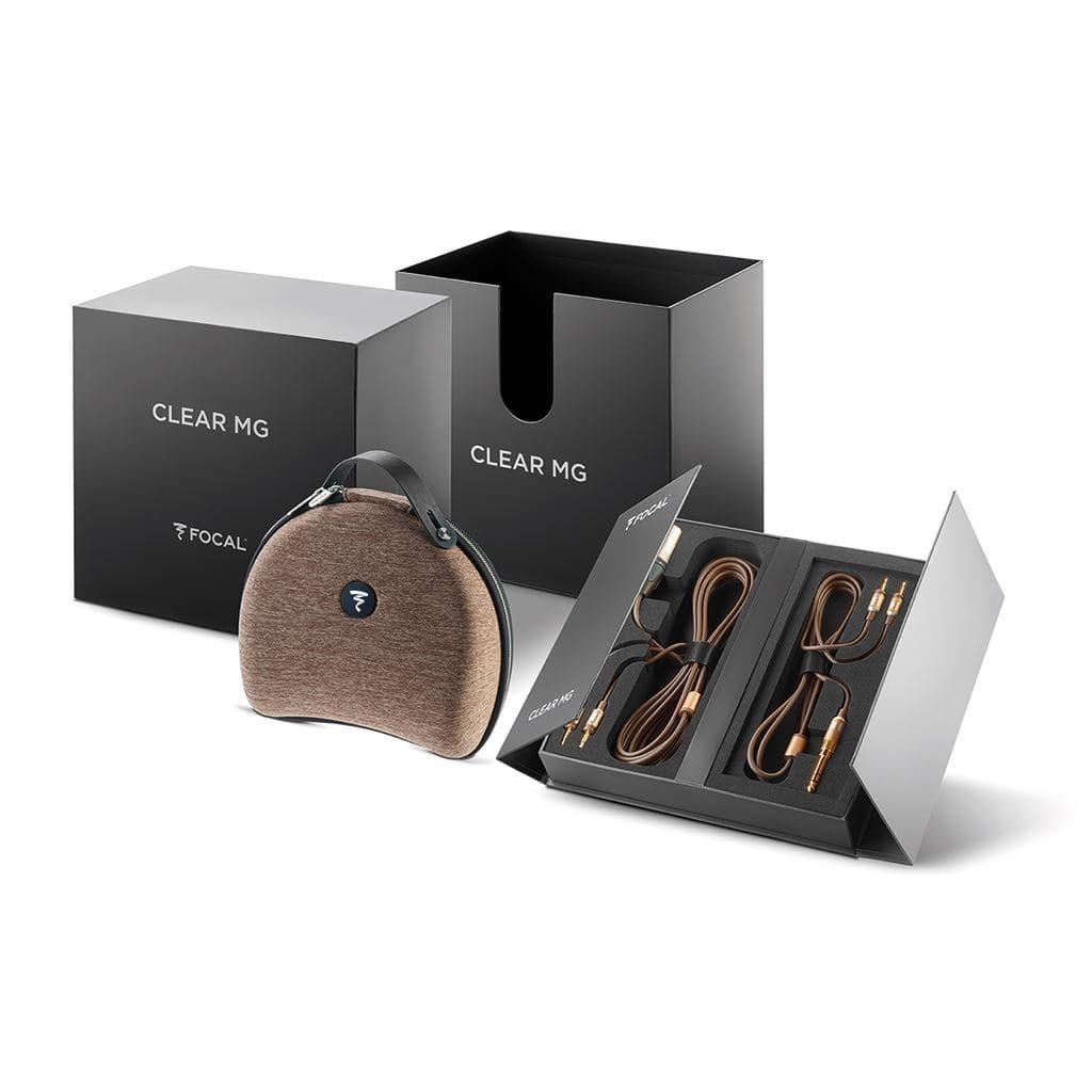 The Focal Clear Mg Headphones by Focal, shown with a brown carrying case, two included cables, and sleek black packaging.
