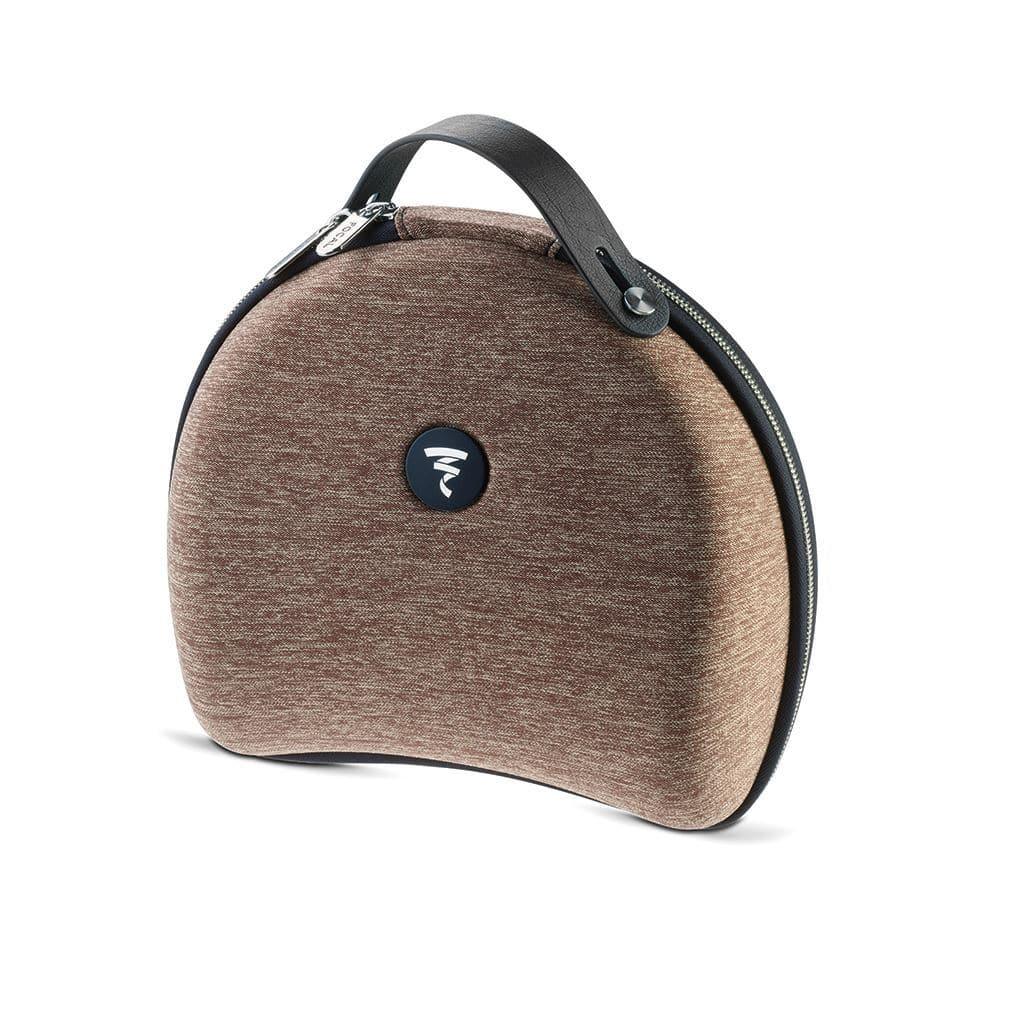 A brown, semi-circular fabric case with a black handle and zipper, featuring a round black logo with white design. Designed by Focal for the Clear Mg headphones.