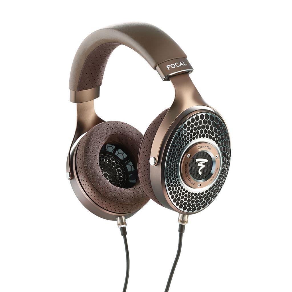 A pair of Focal Clear Mg Headphones by Focal in brown and black, featuring open-back design, large perforated ear pads, mesh outer grille, and cables connected to each ear cup.