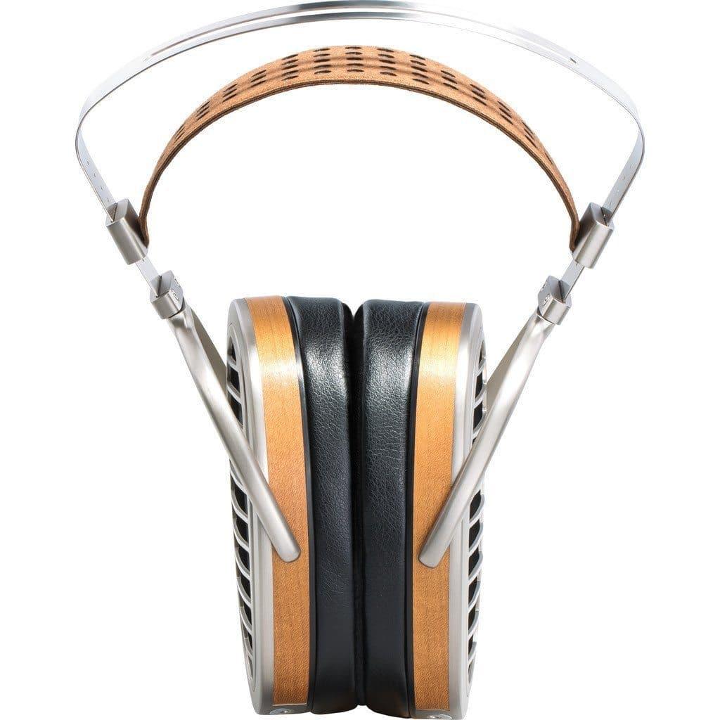The Hifiman HE1000 V4 Headphones - Stealth Magnet Edition feature silver metal, black padding, and wooden accents, shown front-facing with ear cups pressed together beneath a curved headband.