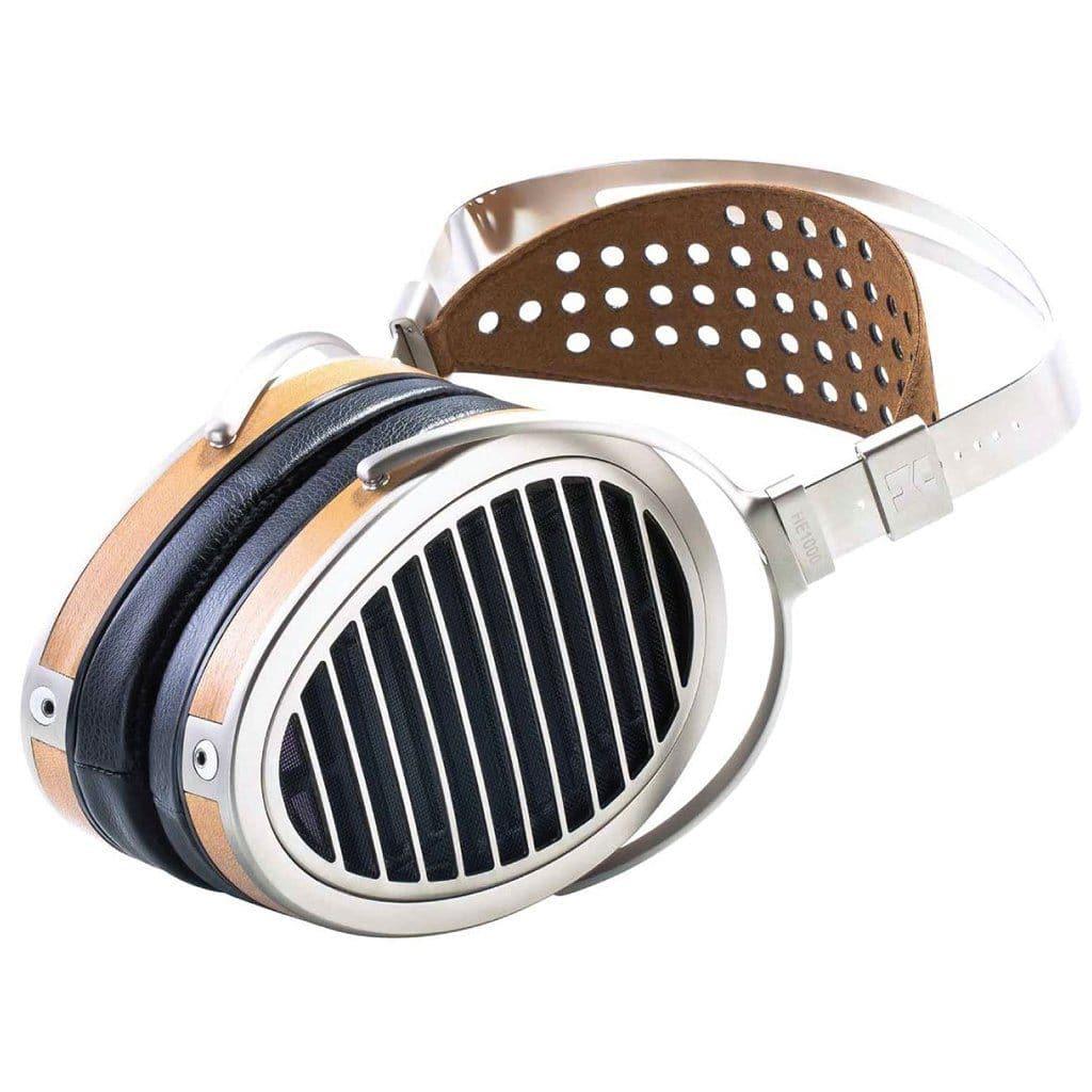 The Hifiman HE1000 V4 Stealth Magnet Edition headphones feature a silver frame, wooden accents, black ear cushions, and a brown padded headband with circular cutouts.