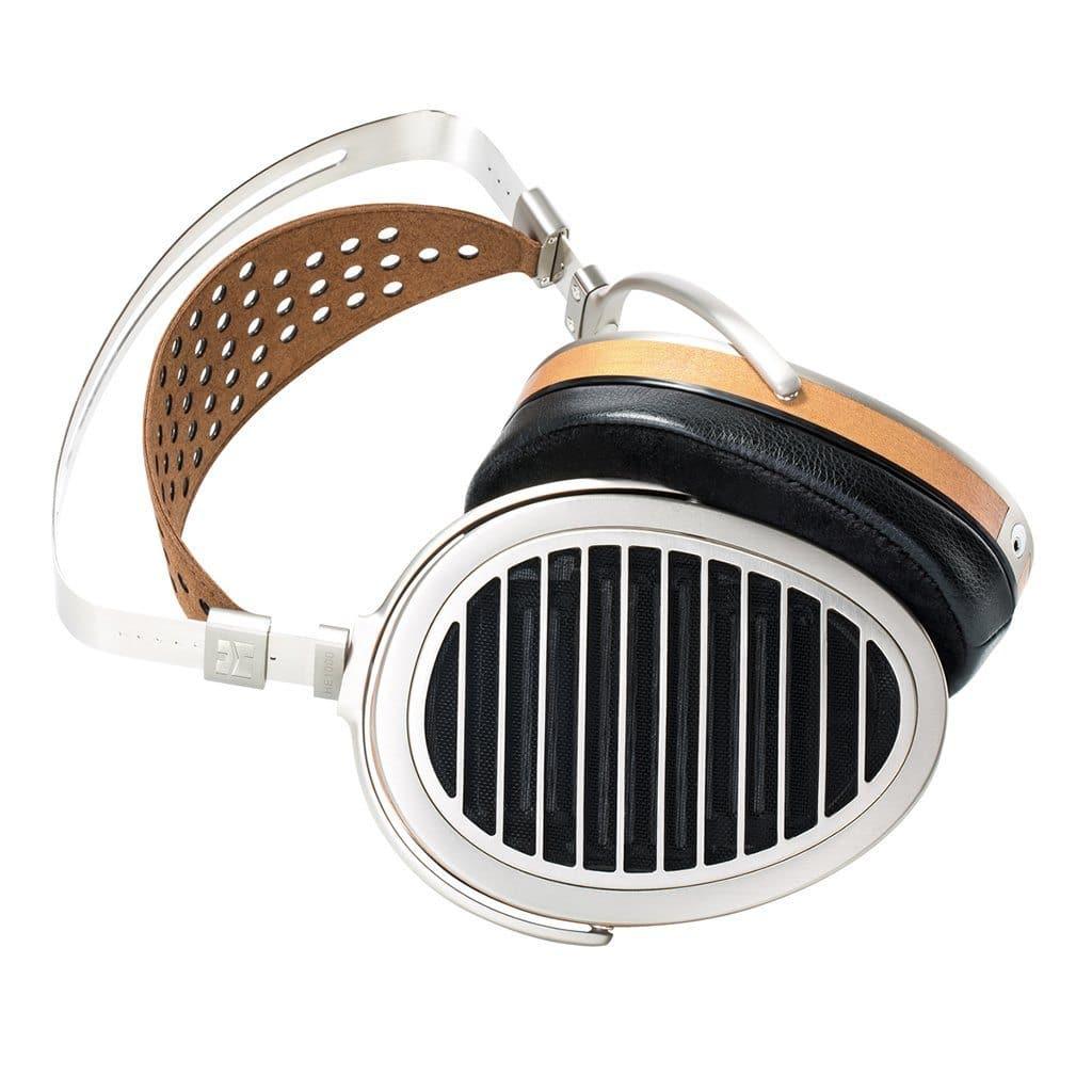 The Hifiman HE1000 V4 Headphones - Stealth Magnet Edition are high-end open-back headphones with a silver and wood finish, black ear cushions, a perforated brown leather headband, and distinctive vertical grille ear cups.