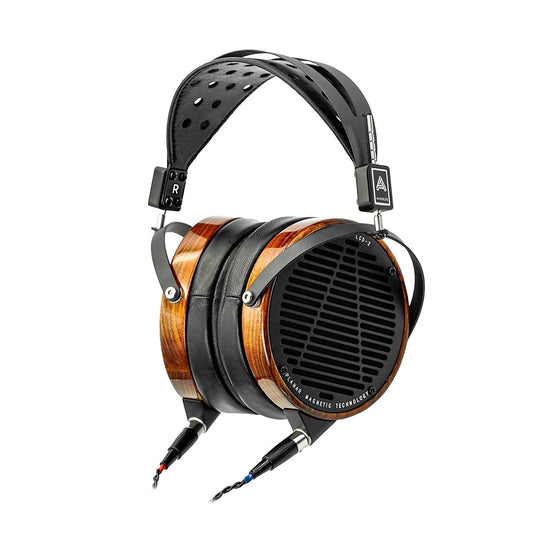 The Audeze LCD-2 Headphones are high-end over-ear planar magnetic headphones with a wood and black metal build, thick padded ear cups, steel headband suspension, and braided cables plugged into each ear cup.