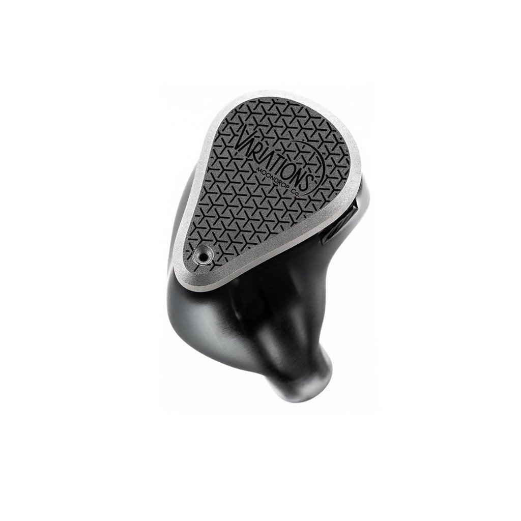 The Moondrop Variations Tribrid In-Ear Headphones by Moondrop feature a black and silver design with a textured triangular faceplate labeled VARIATIONS on a smooth housing, shown against a white background.